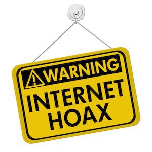 A yellow and black sign with the words Internet Hoax isolated on a white background Warning of Internet Hoax