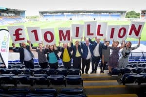 People holding £10m sign at the launch of the growth challenge