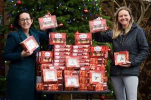 Amy Bould and Sallie Allen with lots of mince pies and Christmas cakes